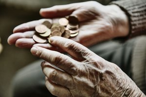 Hands holding coins, representing commodity money