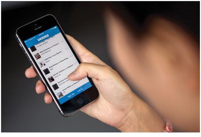 Person using Venmo, an example of digital payment methods
