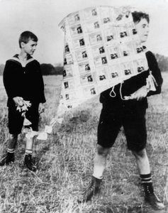 Children playing with kites made from worthless German marks during hyperinflation