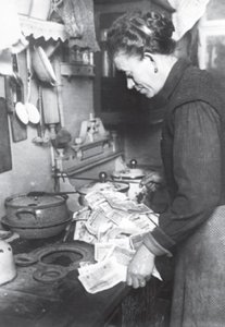 German hyperinflation: woman with worthless currency (duplicate)