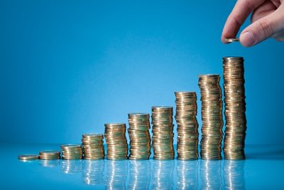 Stacked coins representing growth and compounding