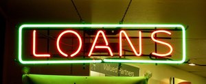 Neon sign reading 'LOANS'