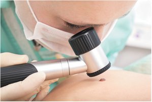 Skin examination with magnifying lens