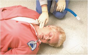 Checking carotid pulse in the neck