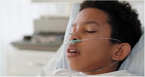 Patient receiving oxygen via nasal cannula