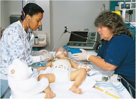 Infant receiving oxygen therapy with respirator
