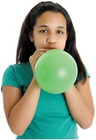 Forceful exhalation (blowing up a balloon)