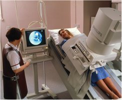 Patient undergoing upper GI series with barium