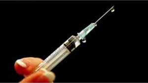 Syringe representing parenteral route of entry