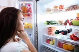 Person looking into refrigerator