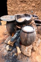 Traditional brewing setup with pots, illustrating the environmental conditions for Streptomyces growth