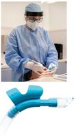 Dental worker using PPE and aerosol control device
