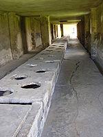 People collecting water from a river