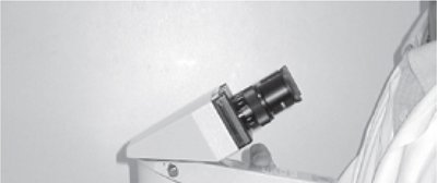 Proper hand placement on microscope arm