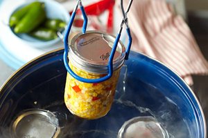 Canning process with jar in boiling water
