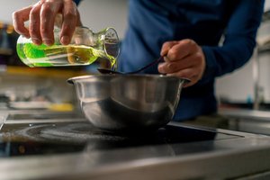 Algal oil being poured for cooking