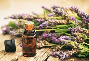 Essential oil bottle and lavender
