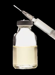 Vial and syringe representing perfectly inelastic demand (e.g., snake antivenin)