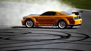 Car drifting, producing smoke (pollution)