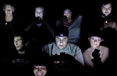 Texting in movies as an example of negative externality