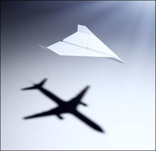 Paper airplane model and real airplane shadow