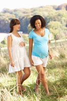 Pregnant women walking outdoors