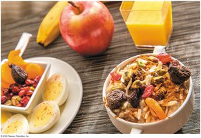 High-carbohydrate meal with fruit, eggs, and juice