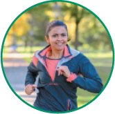 Person jogging in a park, representing cardiorespiratory endurance