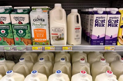 Various milk products on grocery shelves