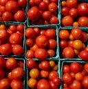 Fresh tomatoes in baskets