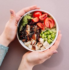 Bowl with tofu, vegetables, and beans as a balanced vegetarian meal