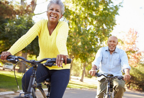 Older adults cycling outdoors, promoting active aging