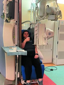 Patient drinking barium during videofluoroscopic study