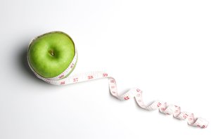 apple with measuring tape representing health promotion