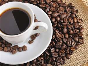 Cup of coffee and coffee beans, representing organic molecules in food