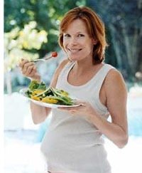 Pregnant woman eating healthy food