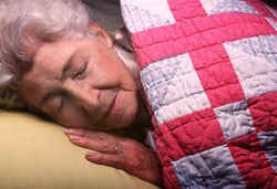 Older adult resting in bed