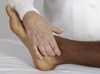 Palpation of posterior tibial pulse