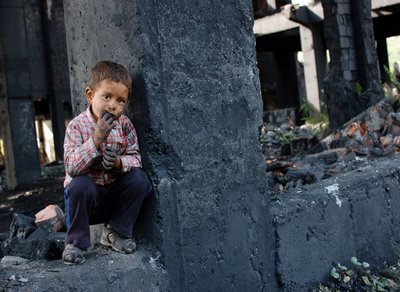 Child in a run-down environment, illustrating social determinants