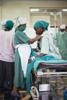 Manual compression for postpartum hemorrhage