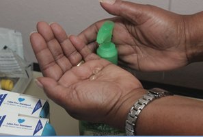 Applying hand sanitizer