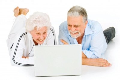 Older adults using a laptop together