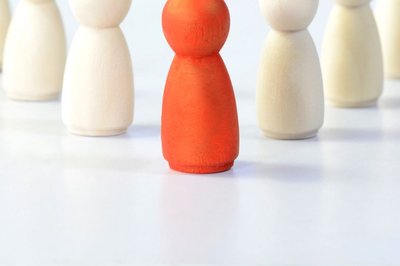 Red figure among white figures, symbolizing active engagement