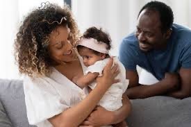 Parents holding infant