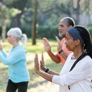 People practicing tai chi outdoors