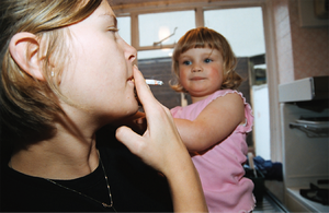 A child exposed to secondhand smoke from an adult