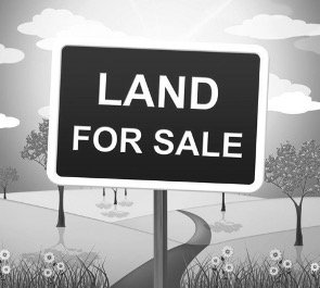 Land for sale sign representing the concept of terra nullius