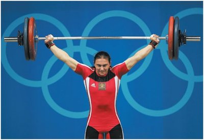 Springboard diver: elastic potential energy to kinetic and gravitational potential energy