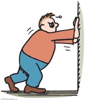 Person pushing against a stationary wall, illustrating no work is done if there is no displacement.