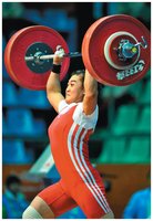 Weightlifter raising a barbell, illustrating work done against gravity.